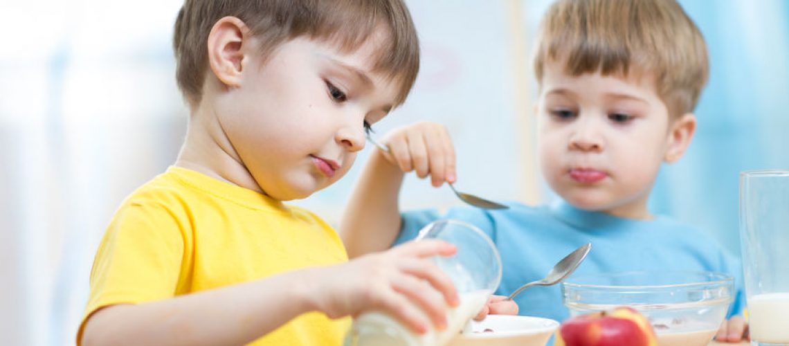42593617 - children eating healthy food in kindergarten or nursery